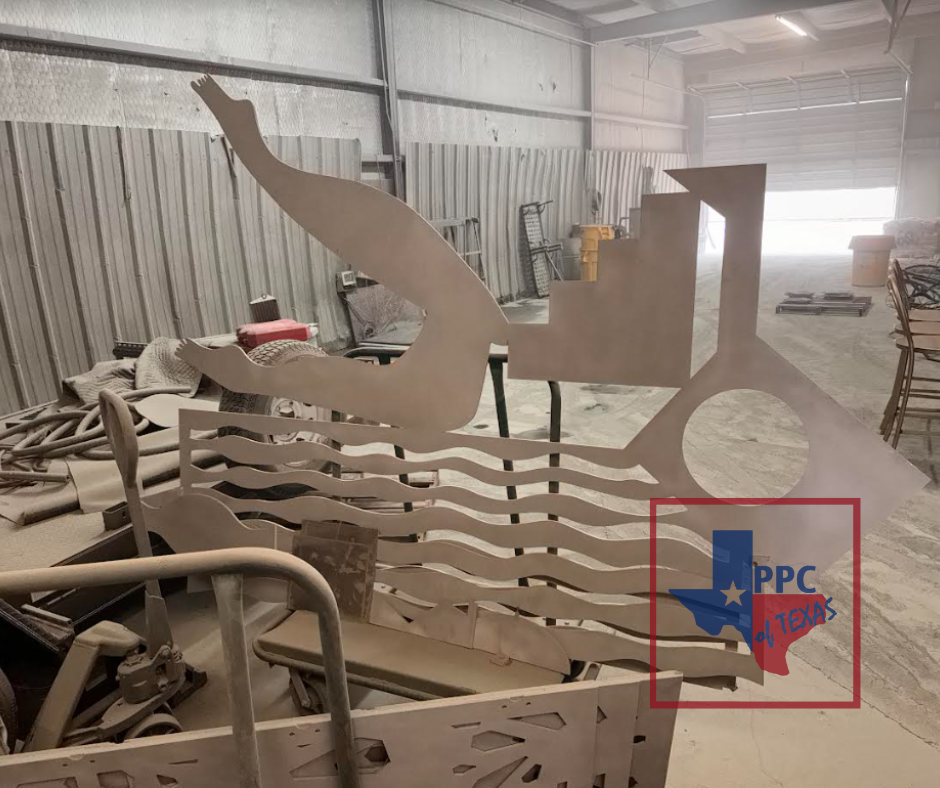 A vibrant and intricate metal sculpture titled 'Katie Trail Art Piece,' showcasing a blend of colors and textures. This artwork, created by a New York artist and brought to life by Powder & Protective Coating Texas, stands as a testament to artistic collaboration and expert craftsmanship.